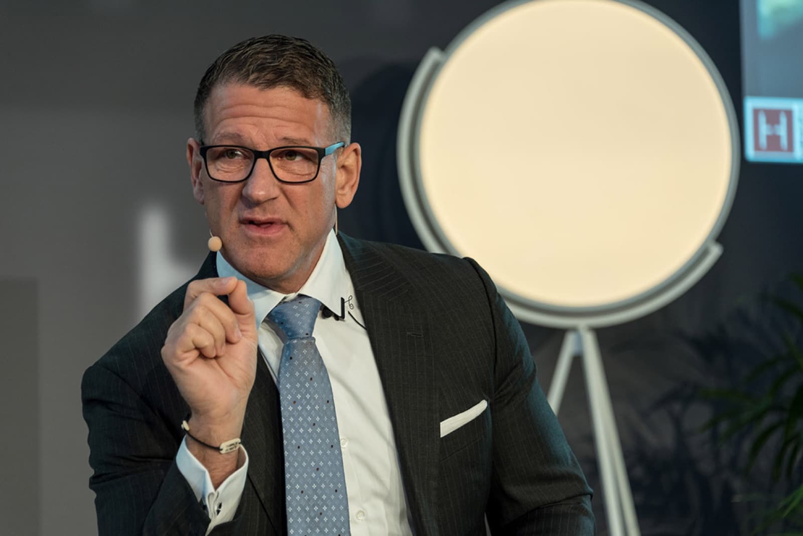 Steven Eugene Kuhn speaking on a business panel